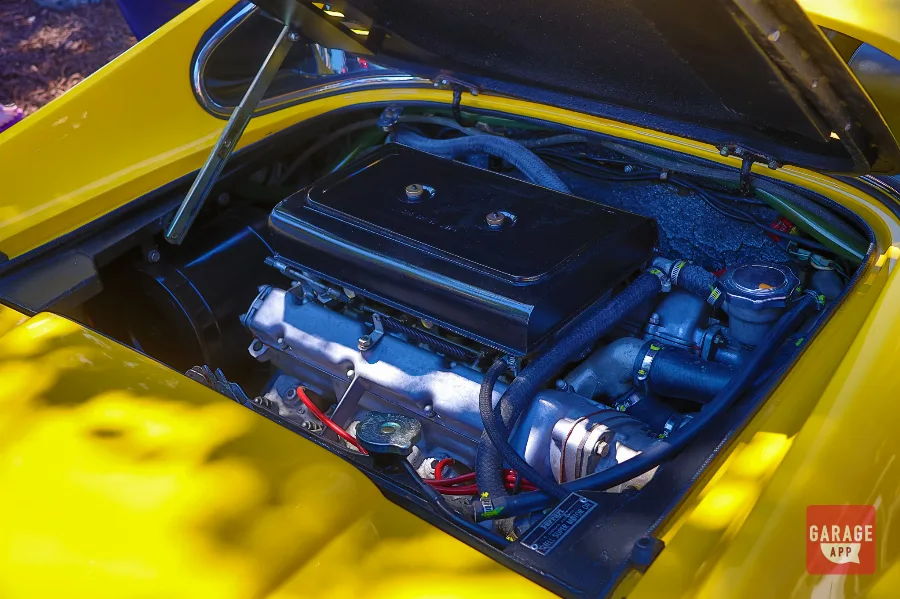 Detail photograph of the rear quarter on a Ferrari Dino 246 GT in Giallo Fly yellow, showcasing the timeless Pininfarina bodywork.