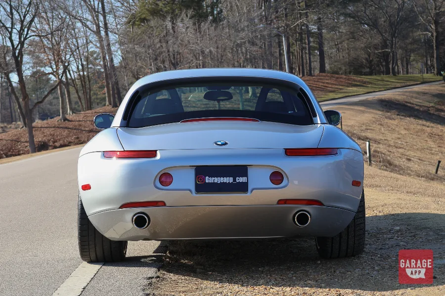 Straight rear view of a 2001 BMW Z8 finished in Titanium Silver Metallic, featuring the signature taillights, BMW Z8 badging, and timeless grand touring design.