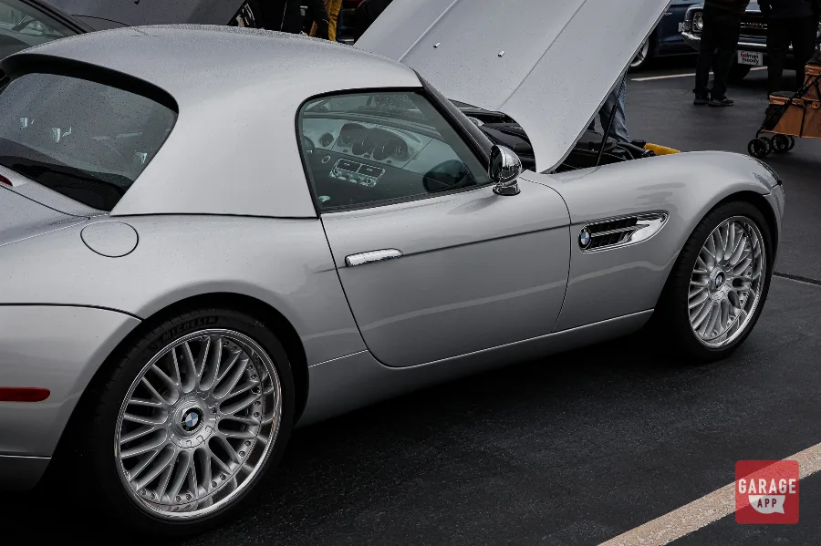 Rear three-quarter photograph of a 2001 BMW Z8 finished in Titanium Silver Metallic, featuring elegant body lines and signature rear styling.