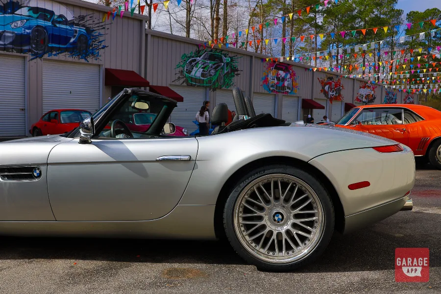 Low-angle shot of a 2001 BMW Z8 in Titanium Silver Metallic, emphasizing its aluminum body and naturally aspirated V8 performance.