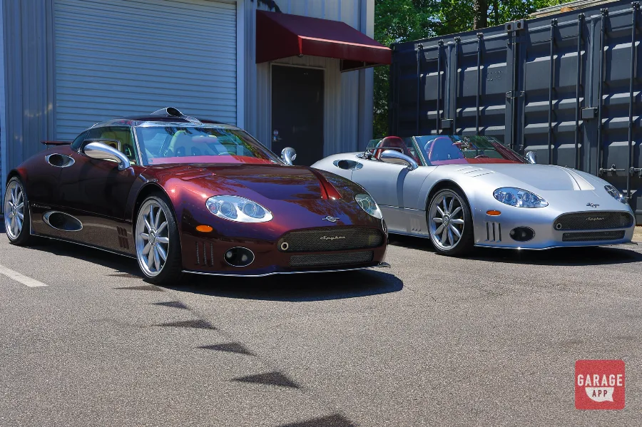 Low-angle view of a 2009 Spyker C8 Laviolette and 2006 Spyker C8 Spyder parked together in North Carolina.
