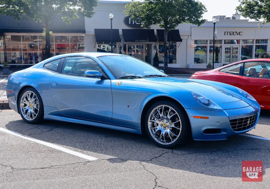 2008 Ferrari 612 Scaglietti in Azzurro California parked at a car show displaying its elegant Pininfarina side profile and V12 grand touring proportions