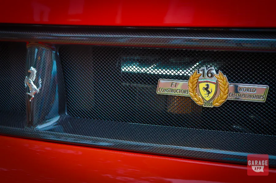 Close-up of the 2009 Ferrari F430 Scuderia Spider 16M F1 Constructors' Championship badge commemorating Ferrari's 16th Formula 1 Constructors' title.
