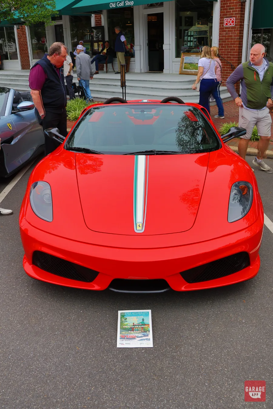 Front view of a 2009 Ferrari F430 Scuderia Spider 16M showcasing its aggressive aerodynamic styling and signature front fascia.