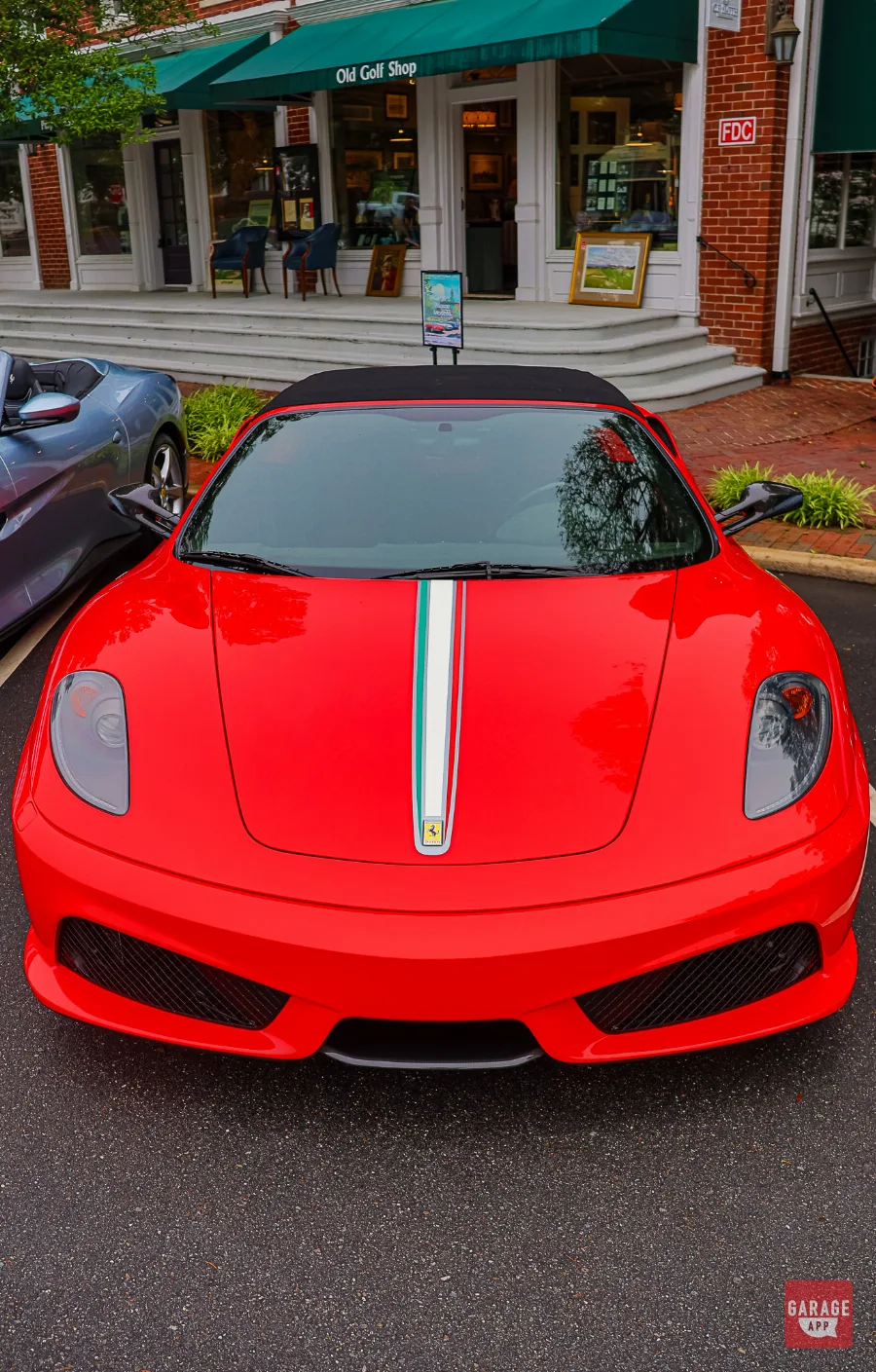 Overhead front view of the 2009 Ferrari F430 Scuderia Spider 16M featuring the iconic Italian tricolor racing stripe and Rosso Corsa paint.