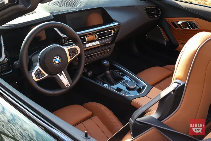 Interior of a BMW Z4 M40i manual featuring premium leather sport seats, a driver-focused cockpit, and BMW's modern performance-inspired cabin design.