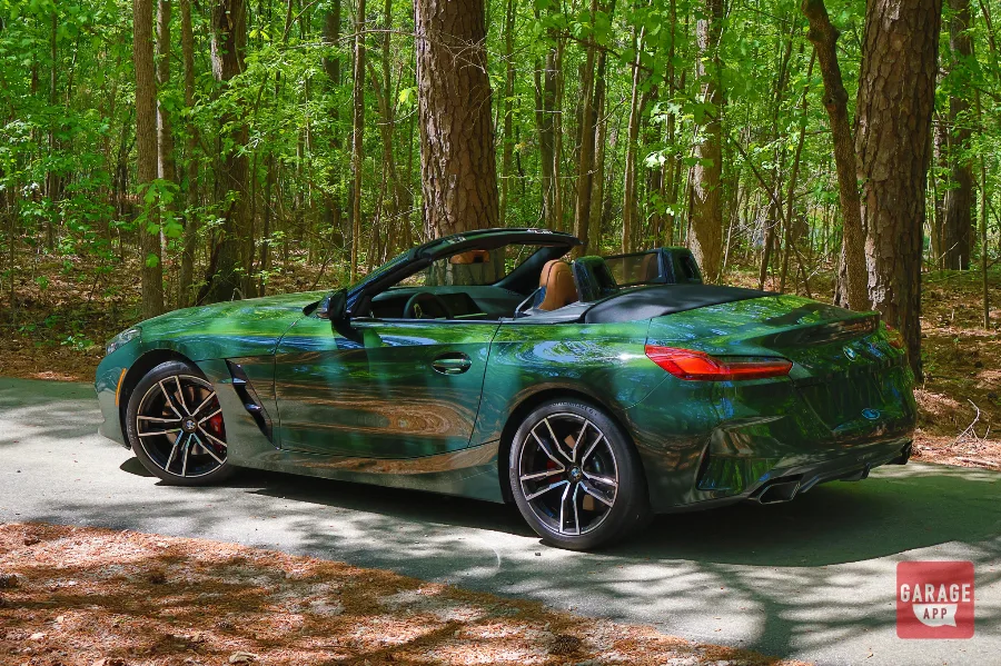 Rear three-quarter photograph of a BMW Z4 M40i manual finished in San Remo Green, featuring sculpted bodywork and signature LED taillights.