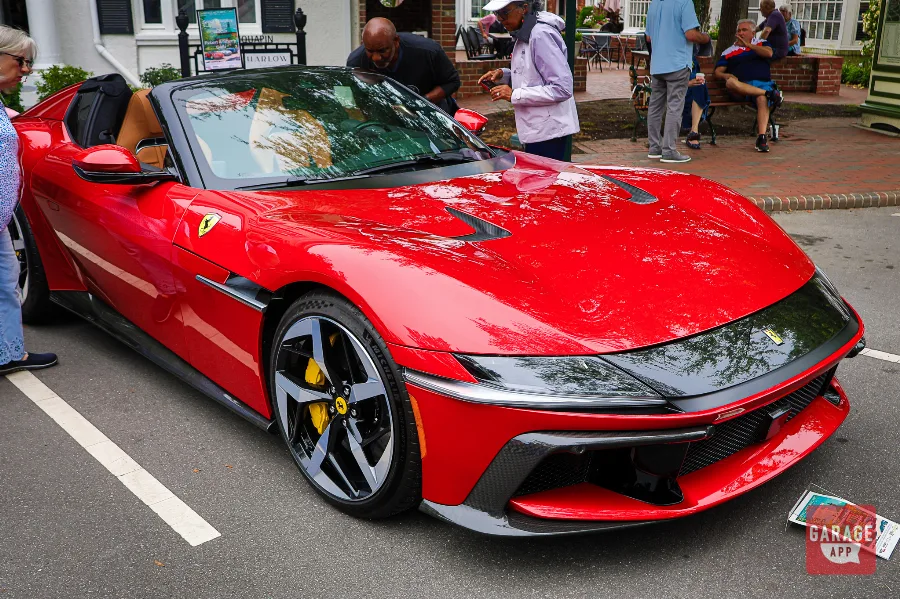 Hero front three-quarter photograph of a 2025 Ferrari 12Cilindri Spider in Rosso Corsa showcasing Ferrari's naturally aspirated V12 grand tourer.