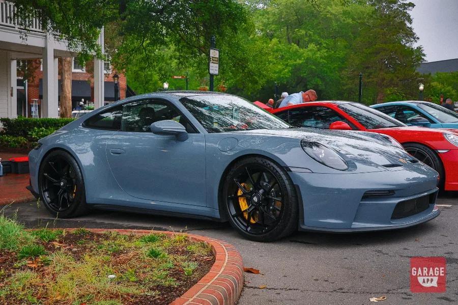 Slate blue Porsche 911 GT3 Touring side profile parked at Sandhills Motoring Expo North Carolina