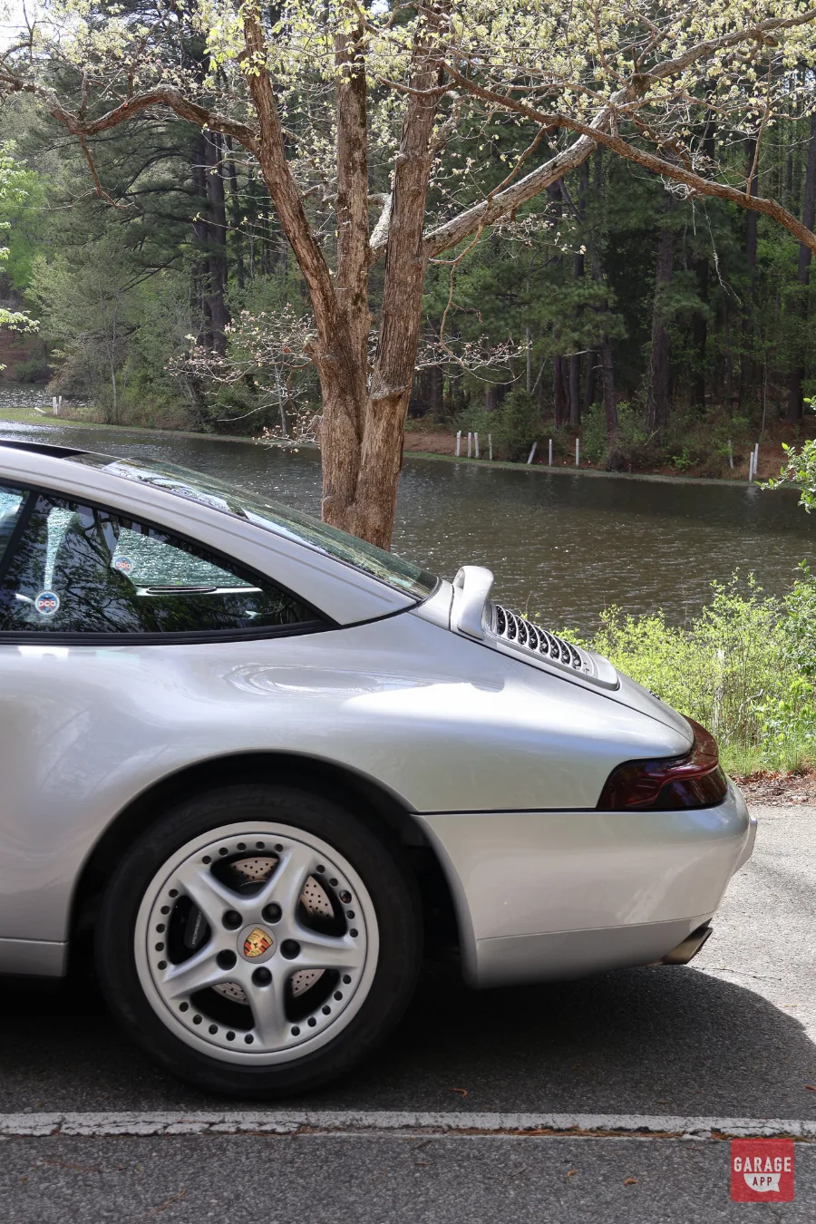Detailed exterior photograph of a Porsche 993 Targa, the final generation of air-cooled Porsche 911s.