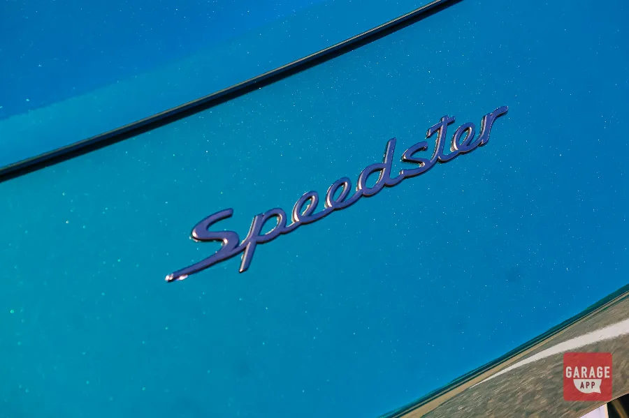 Close-up of the Speedster script and exterior badging on a green Porsche 911 Speedster.