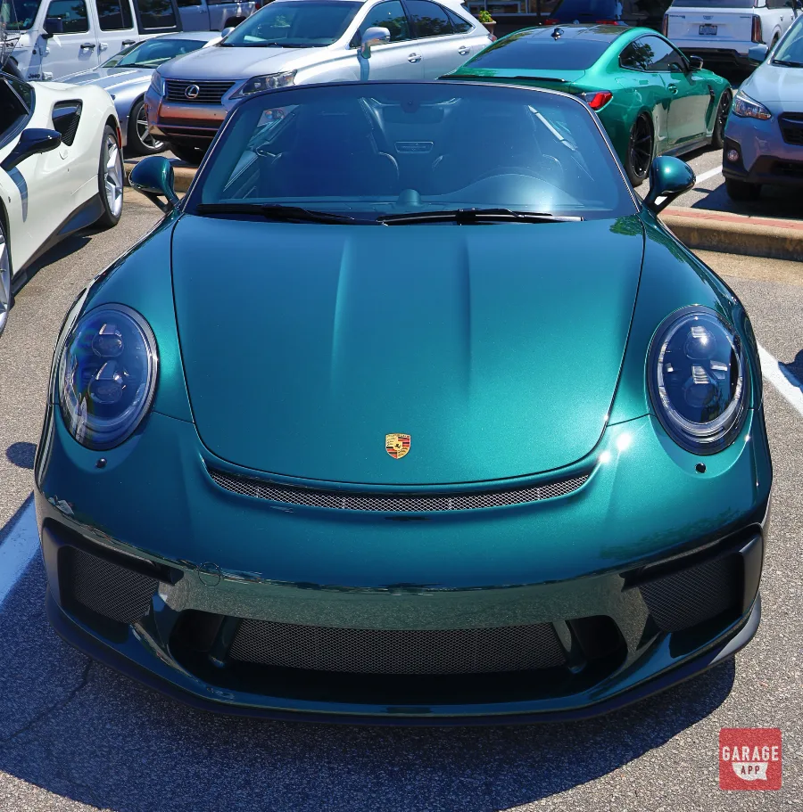 Elevated view of a Porsche 911 Speedster showing the unique roofless design and flowing rear deck contours.