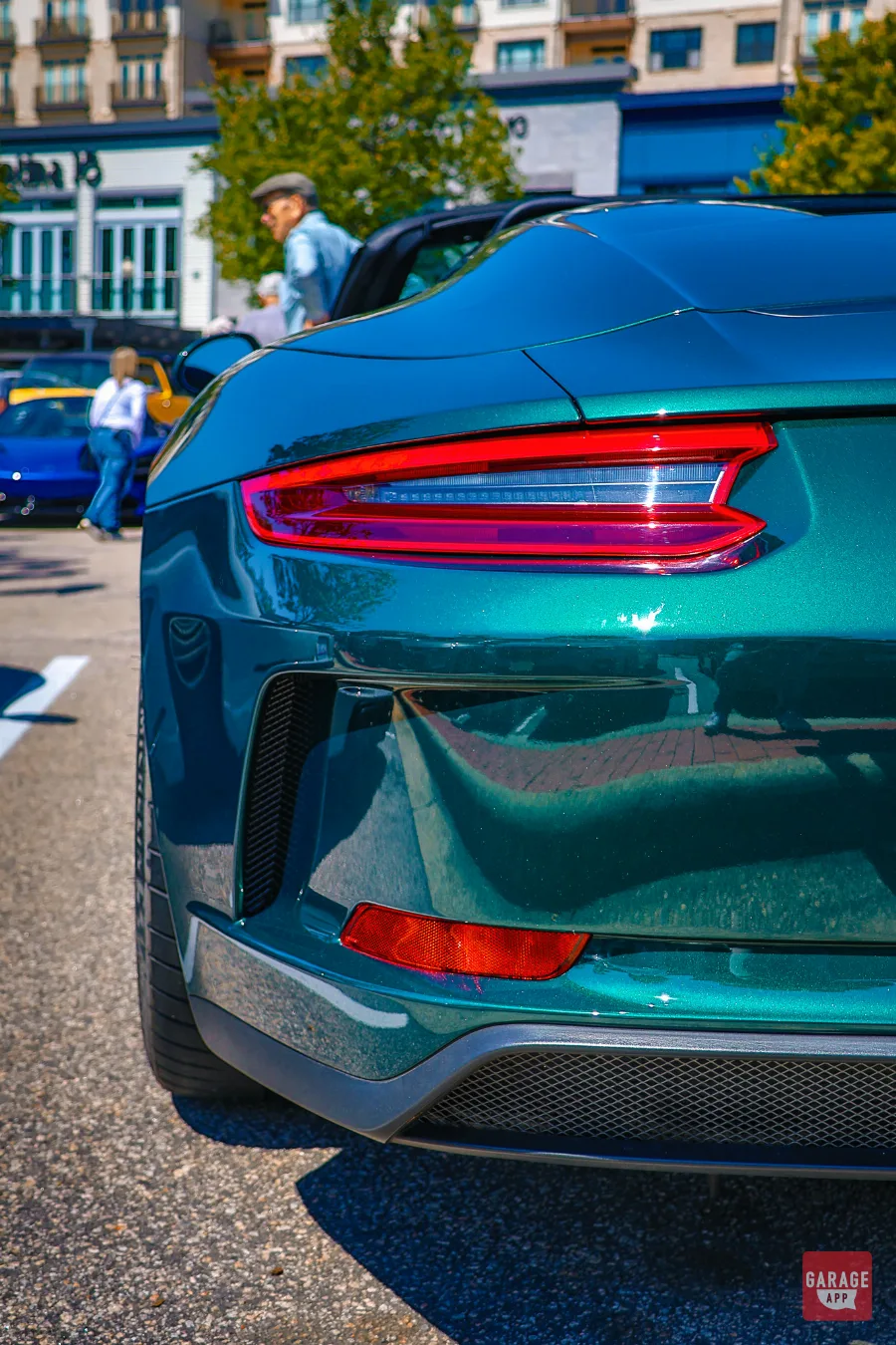 Dynamic low-side angle of a green Porsche 911 Speedster emphasizing its athletic stance and timeless Porsche design.