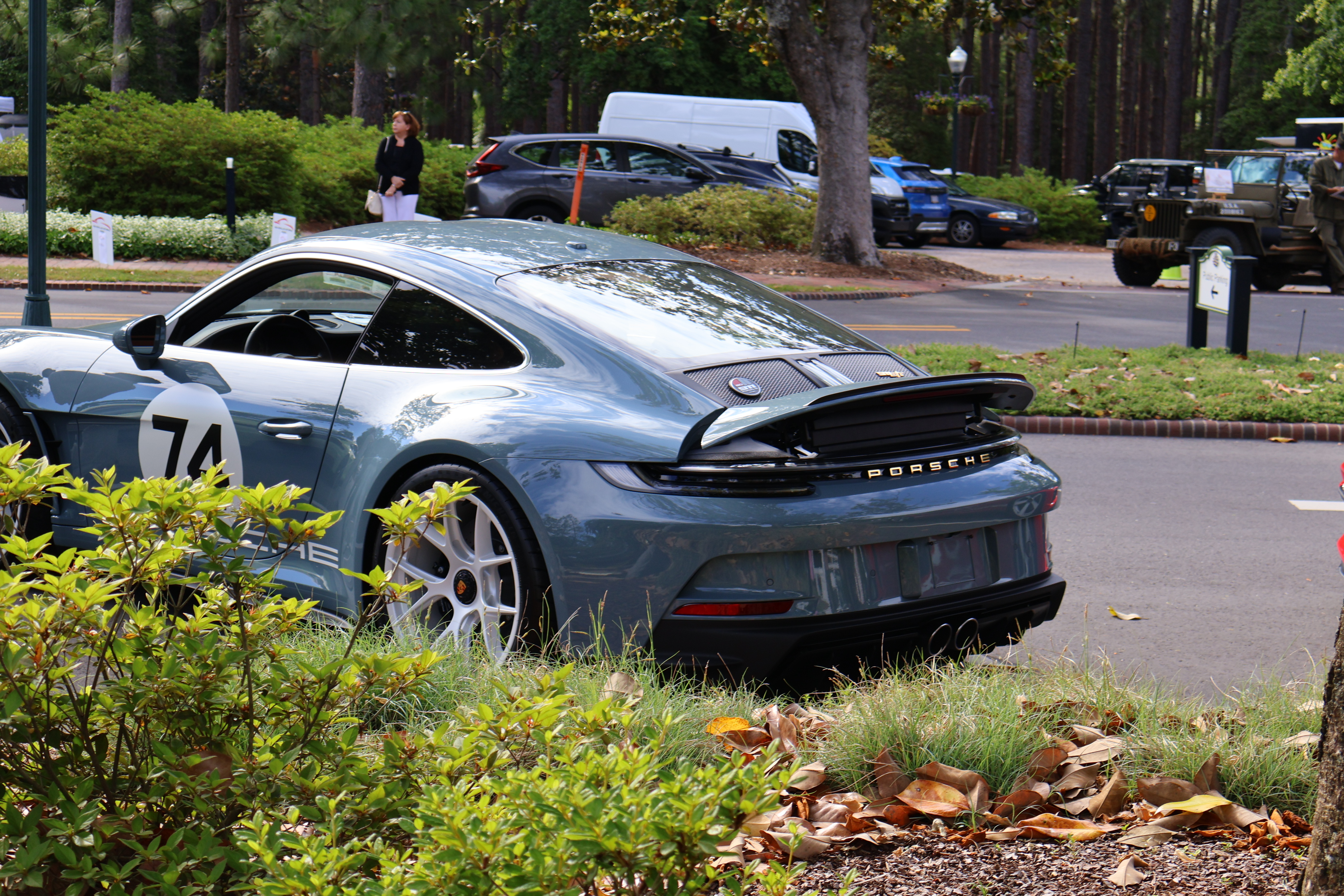 Modern Porsche 911 S/T  parked during a Porsche community gathering showcasing timeless rear-engine sports car design.