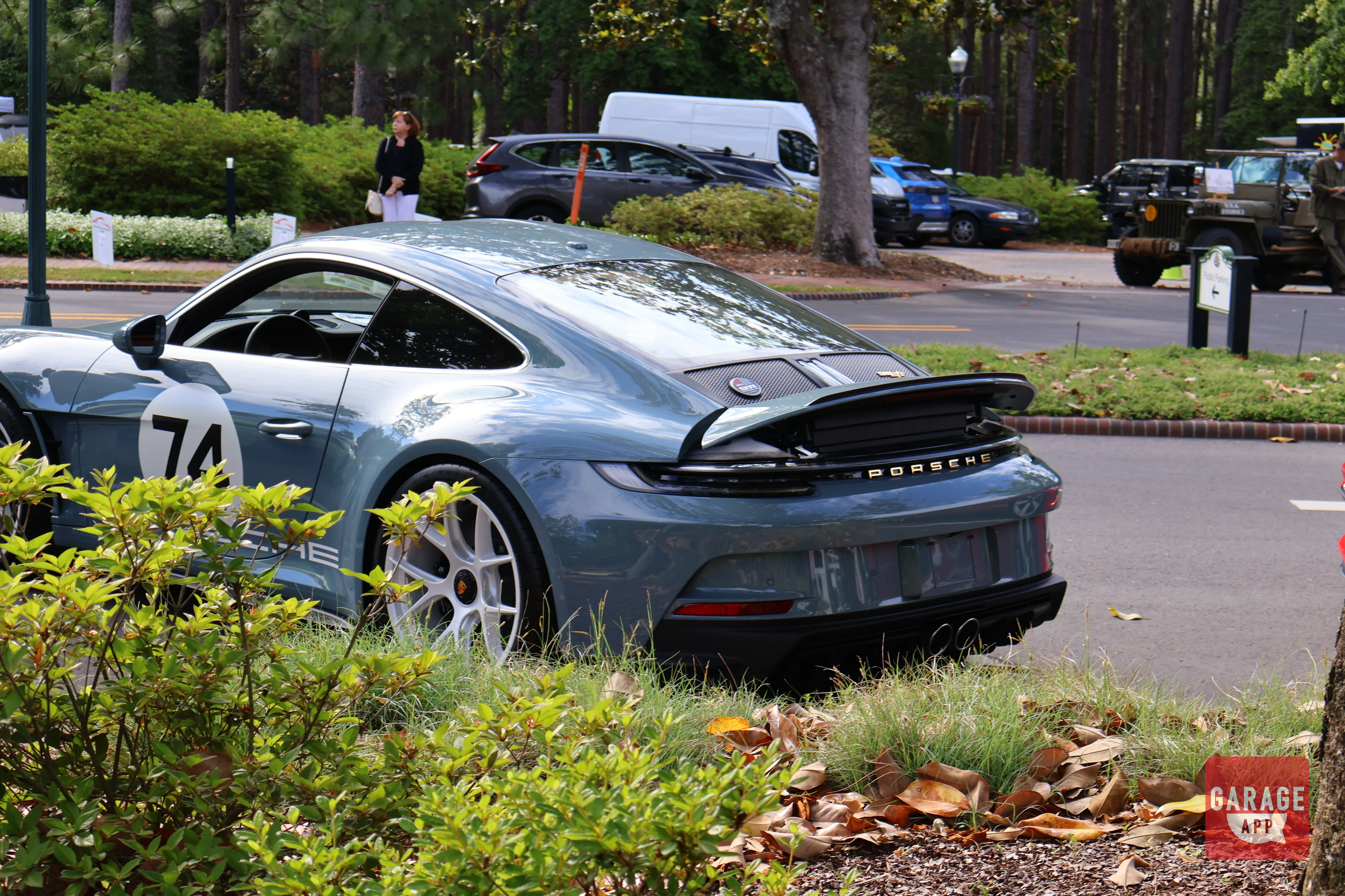 Modern Porsche 911 S/T  parked during a Porsche community gathering showcasing timeless rear-engine sports car design.