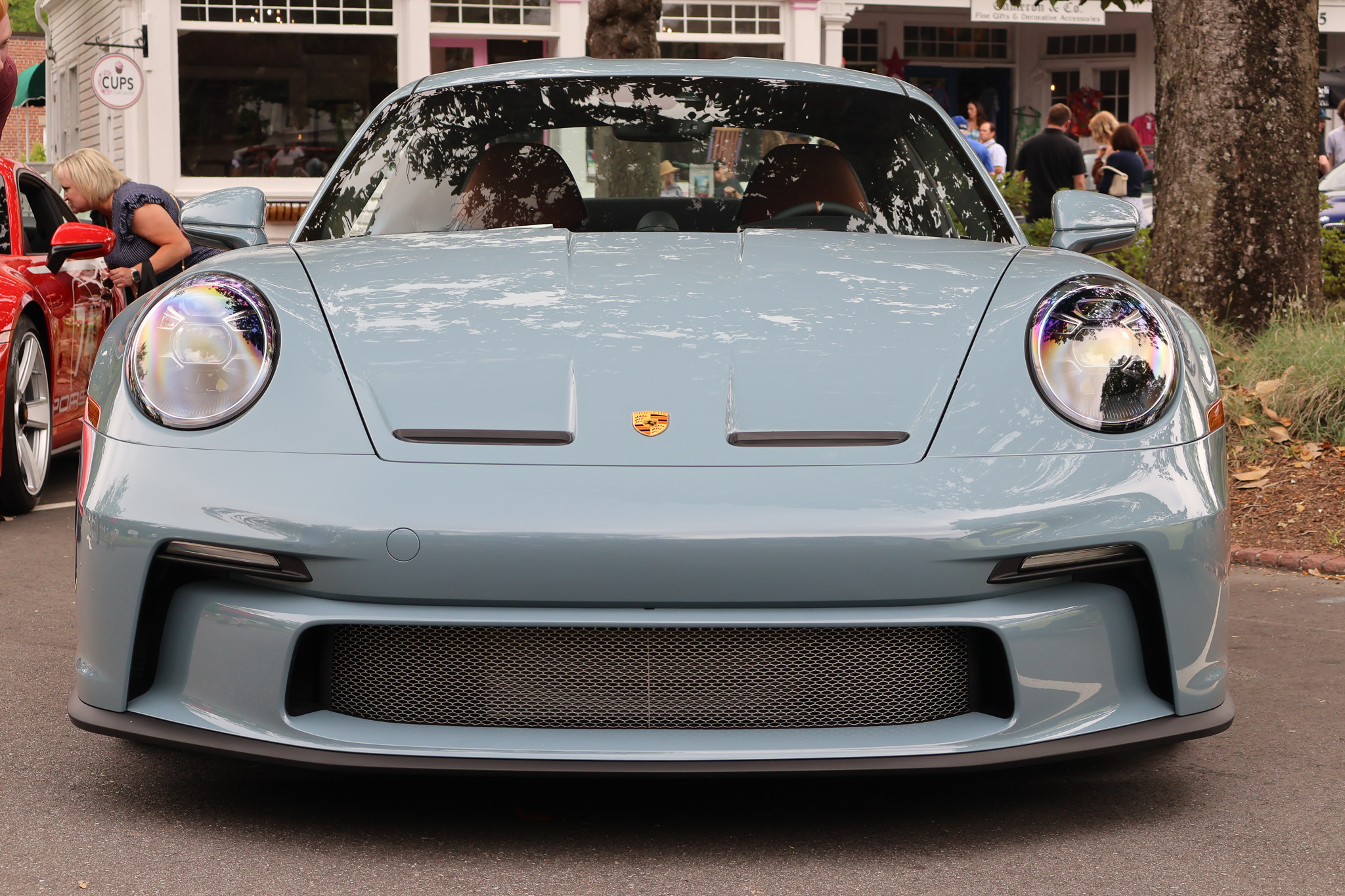 Front view of a 2024 Porsche 911 S/T in Shore Blue Metallic, displaying the signature round headlights and naturally aspirated Porsche performance.Front view of a 2024 Porsche 911 S/T in Shore Blue Metallic, displaying the signature round headlights and naturally aspirated Porsche performance.