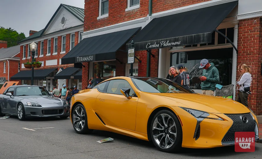 Front three-quarter view of a Lexus LC 500 showcasing its naturally aspirated V8 engine and distinctive grand touring design.