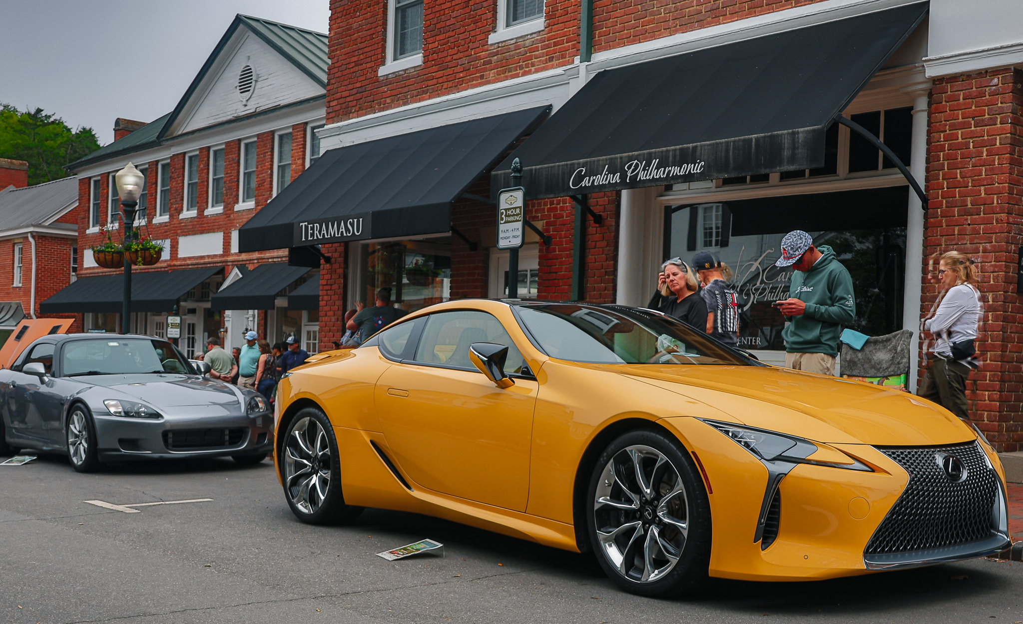 Front three-quarter view of a Lexus LC 500 showcasing its naturally aspirated V8 engine and distinctive grand touring design.