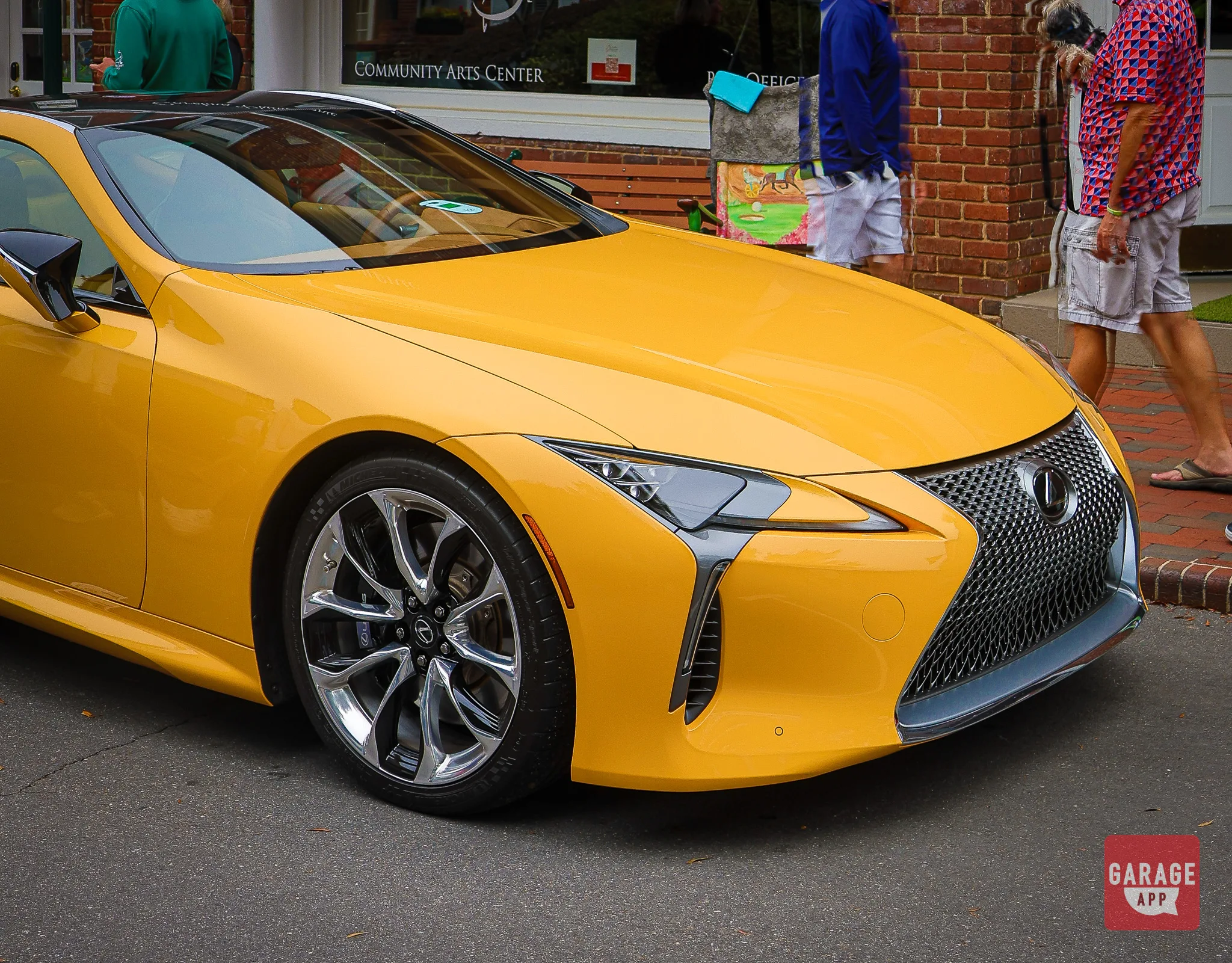 Lexus LC 500 front three-quarter view showing the spindle grille and low wide stance