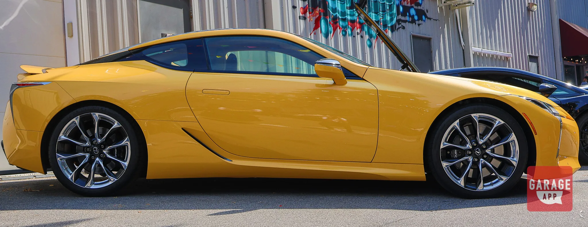 Side profile of a Lexus LC 500 highlighting the sleek roofline and luxury sports coupe proportions.