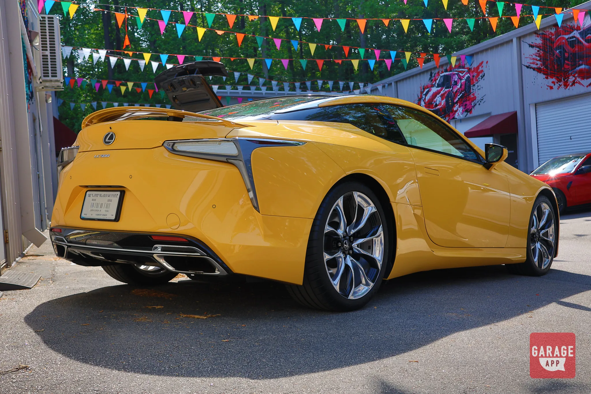 Rear three-quarter photograph of a Lexus LC 500 featuring sculpted bodywork and signature LED taillights.