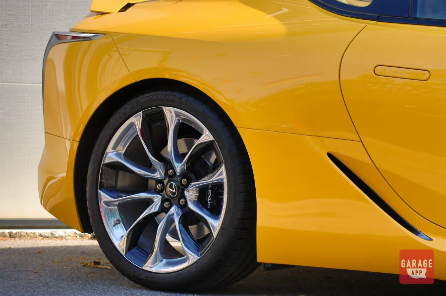 Detail photograph of Lexus LC 500 alloy wheels and high-performance braking components.