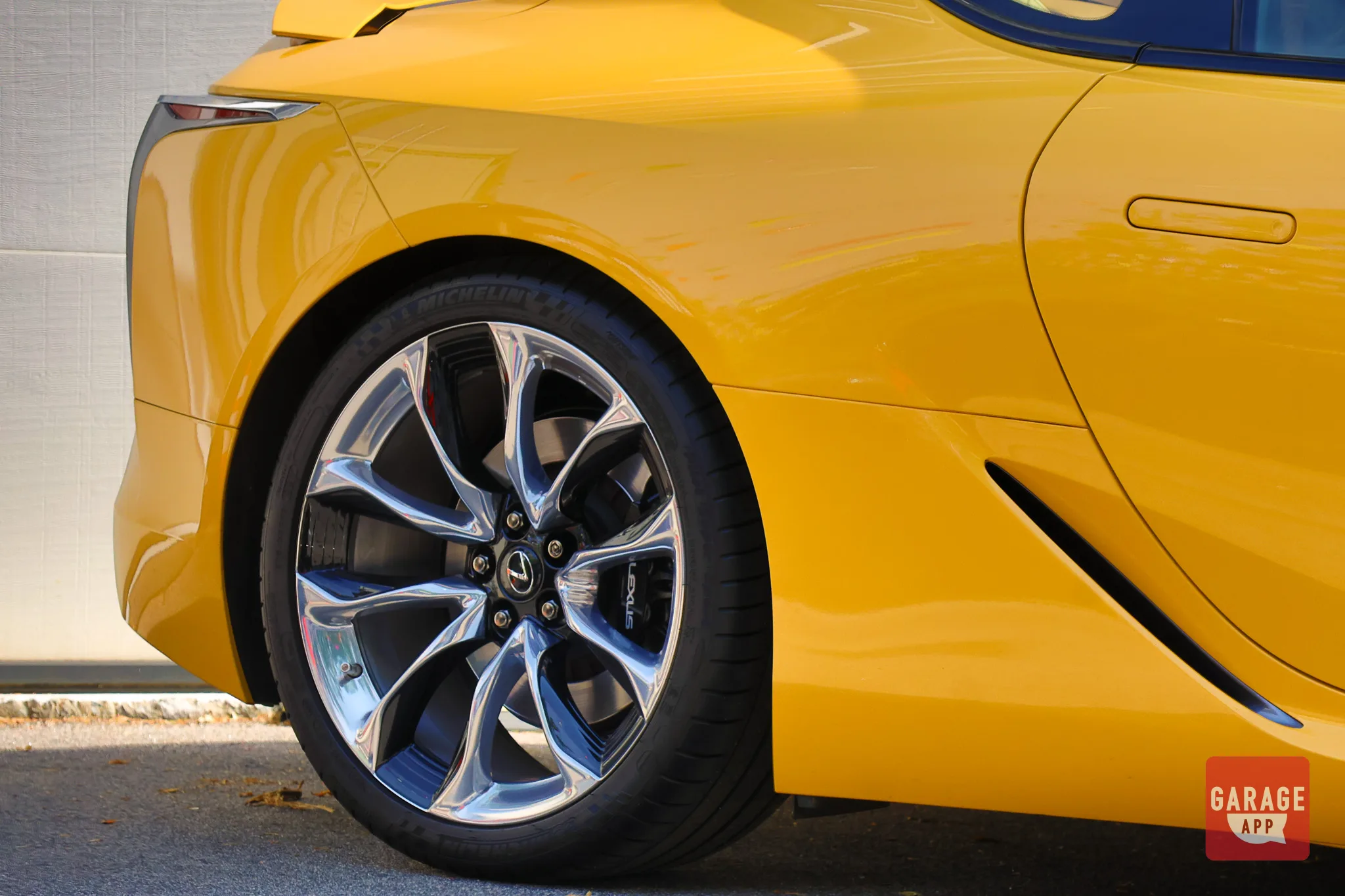 Detail photograph of Lexus LC 500 alloy wheels and high-performance braking components.