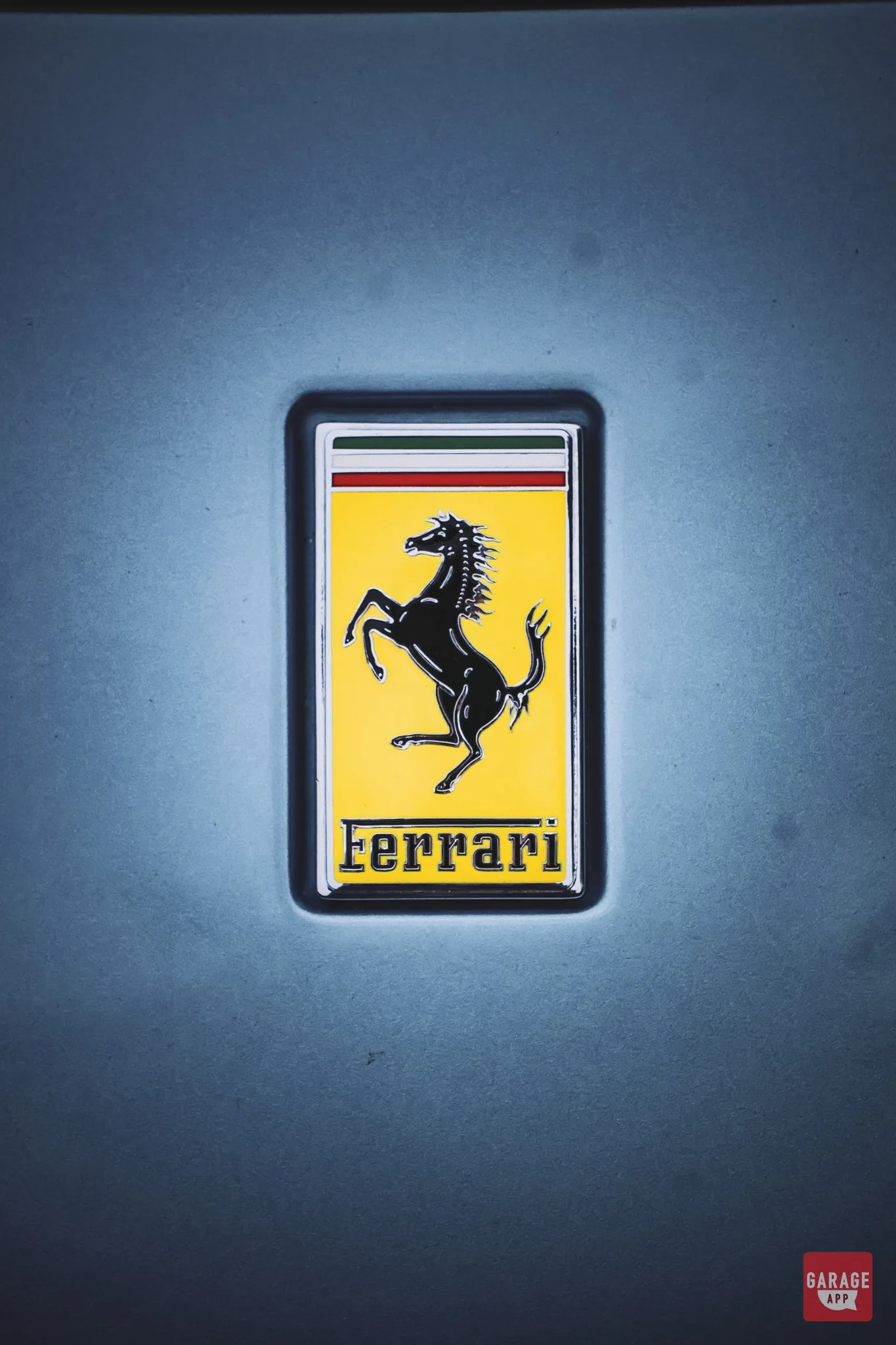 The iconic Ferrari prancing horse badge mounted on the side fender of this Ferrari Portofino.
