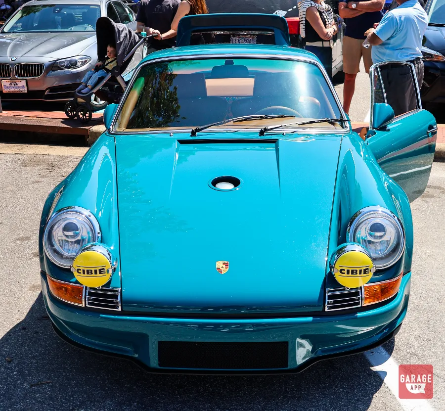 Custom Singer Porsche 911 parked outdoors, highlighting the blend of classic Porsche design and modern performance.