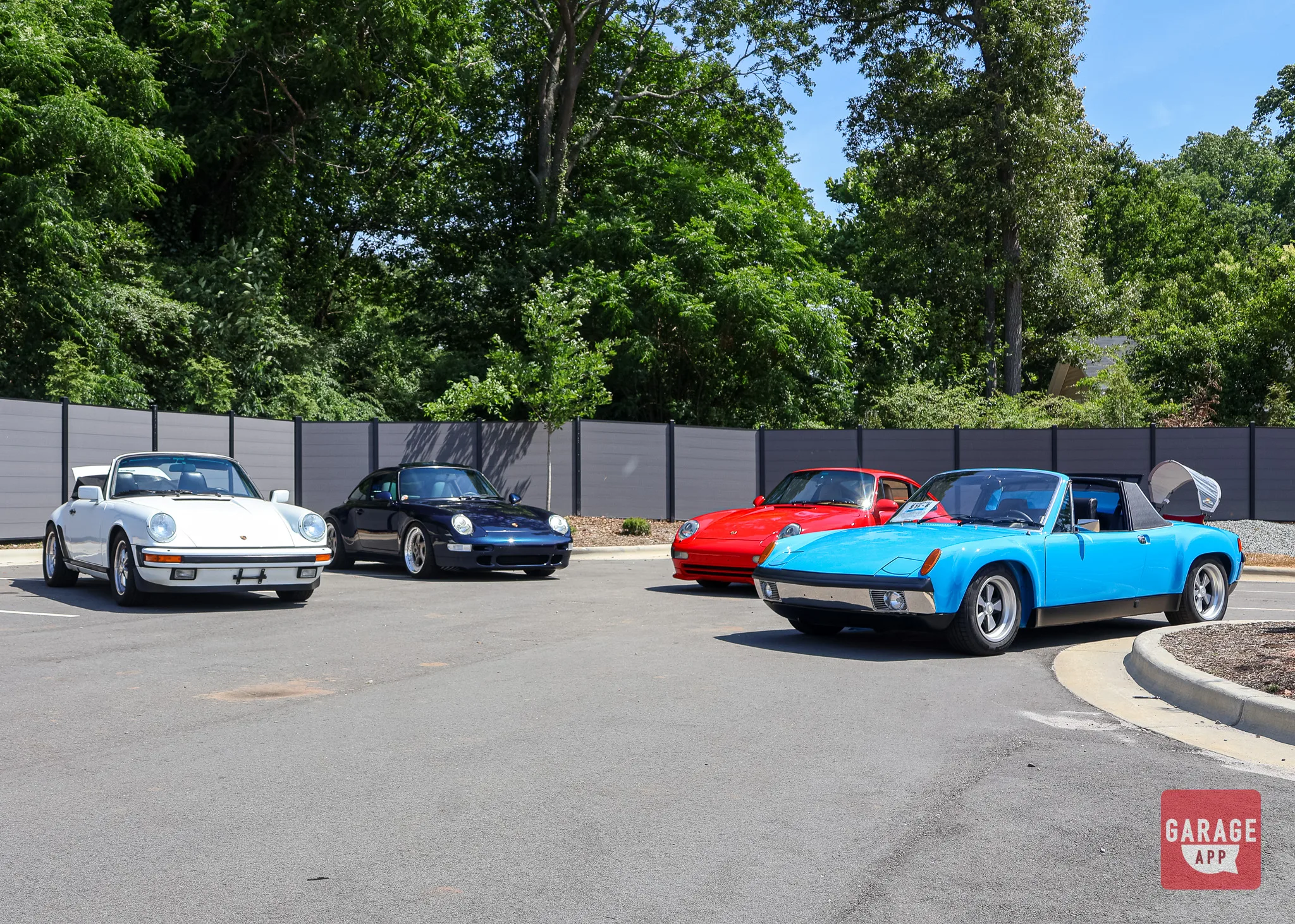 Classic Porsche lineup featuring a Porsche 914/6, Porsche 911 Cabriolet, Porsche 993, and Porsche 993 Carrera at Fuquay-Varina Cars and Coffee.