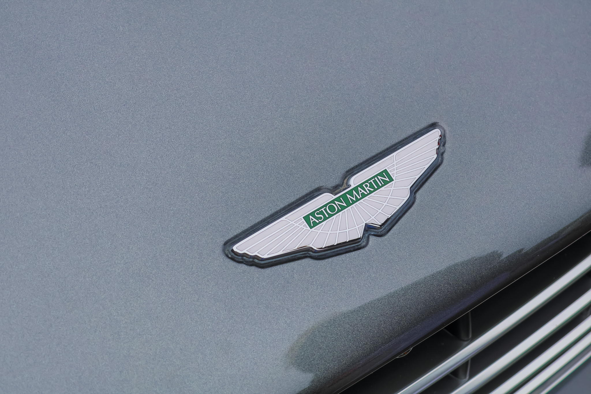 Aston Martin wings badge hood emblem close-up