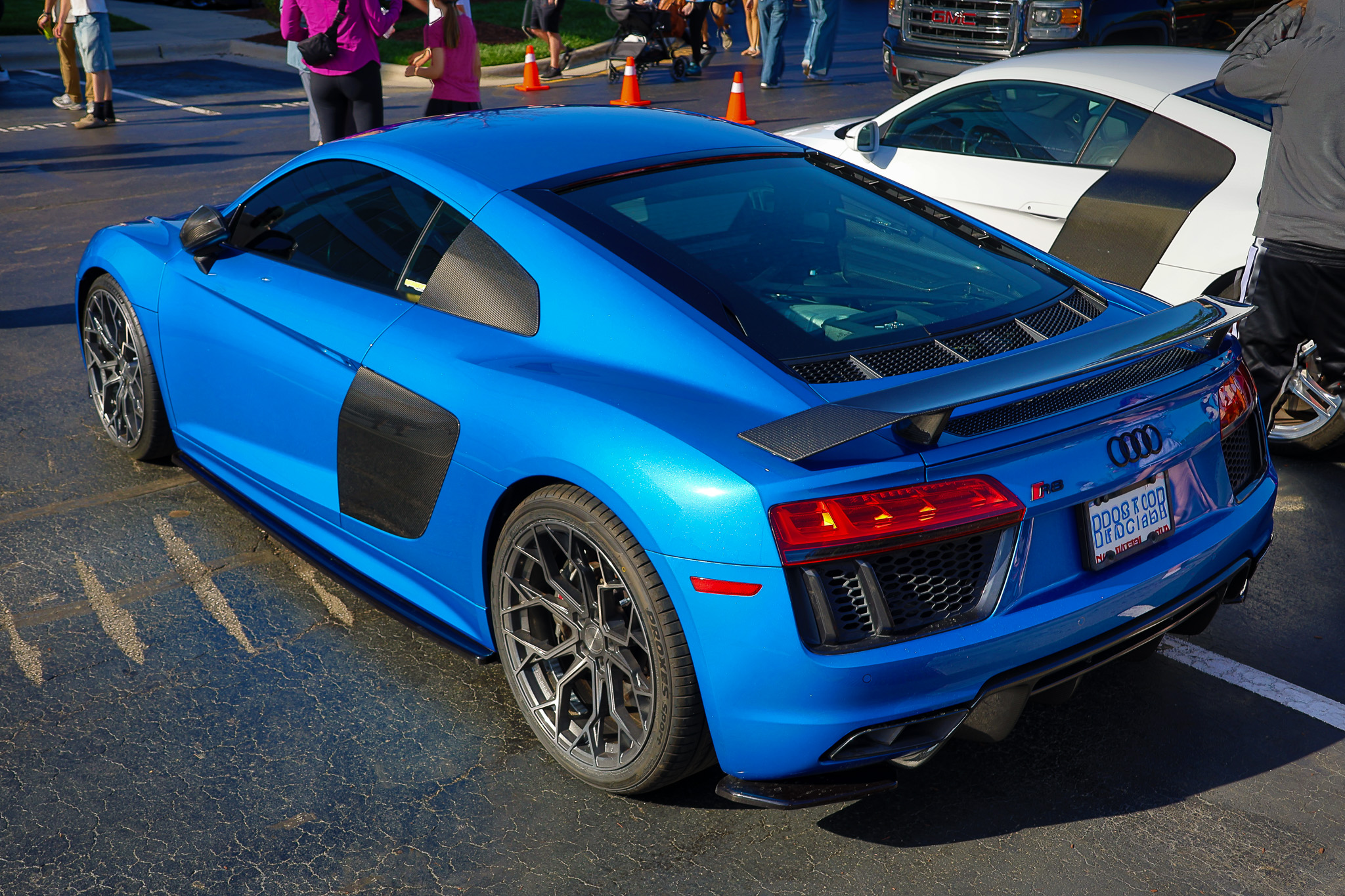 Blue Audi R8 rear quarter view with carbon fiber engine cover