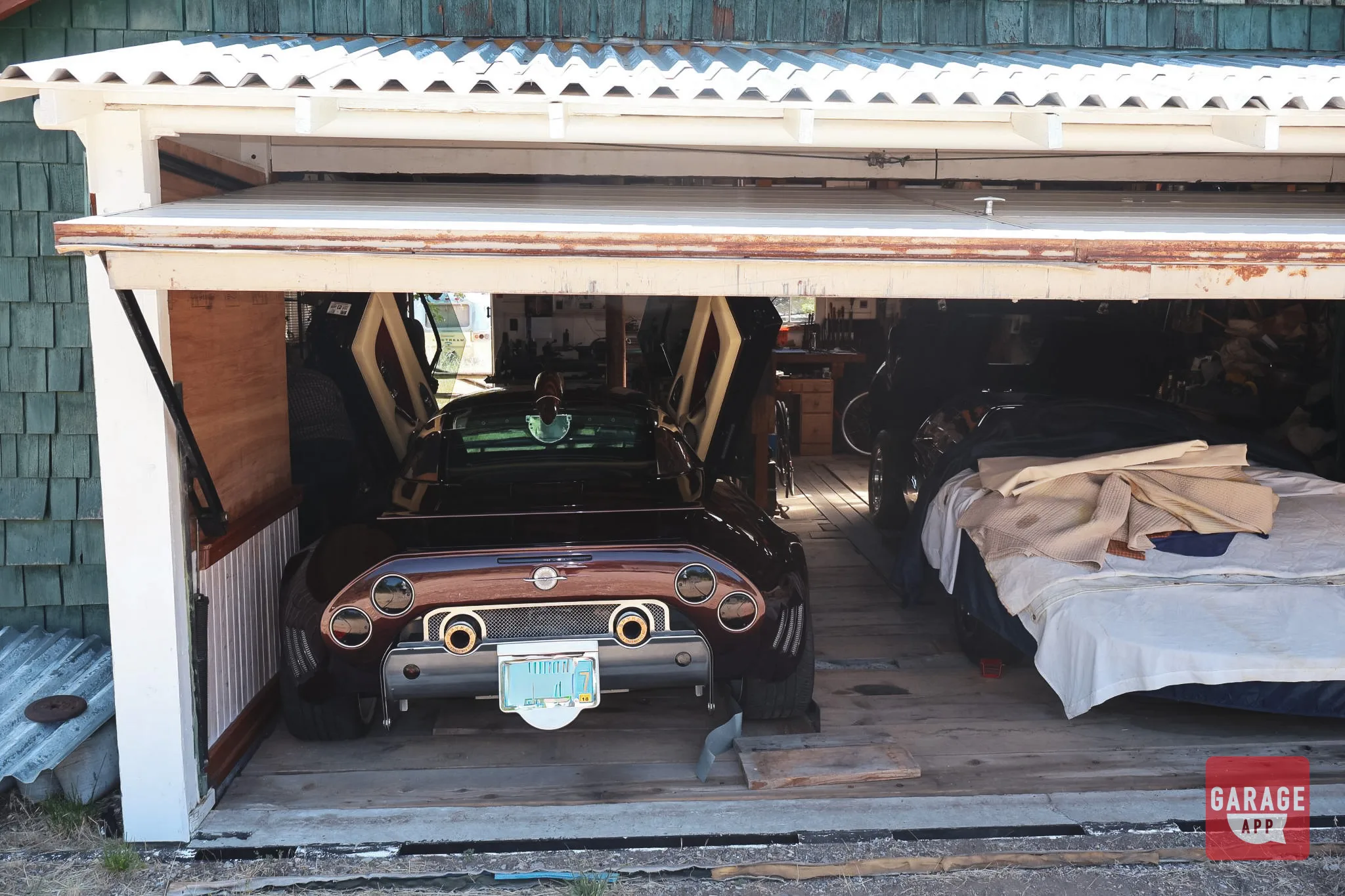 The Spyker as found, viewed from outside the barn in Northern California