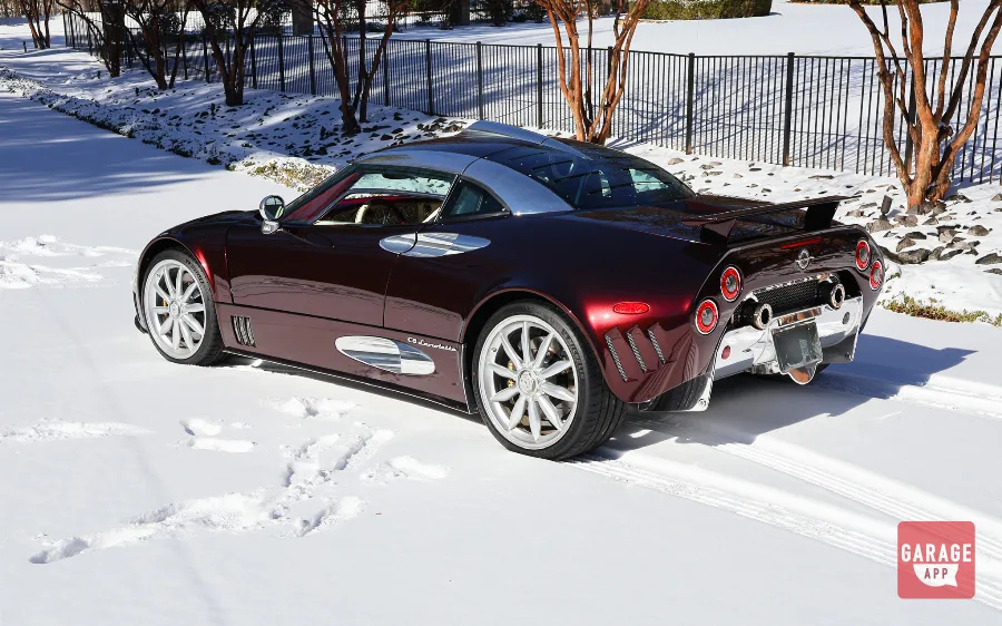 Madeira Red Spyker C8 Laviolette rear three-quarter view parked in fresh snow
