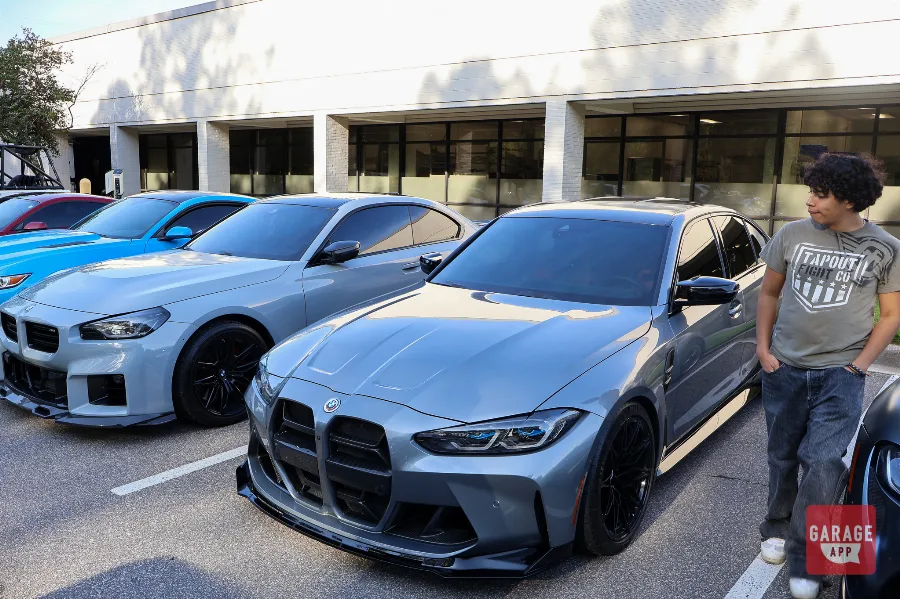 BMW G80 M3 parked beside a BMW G87 M2 at Cars and Coffee Morrisville in Raleigh.