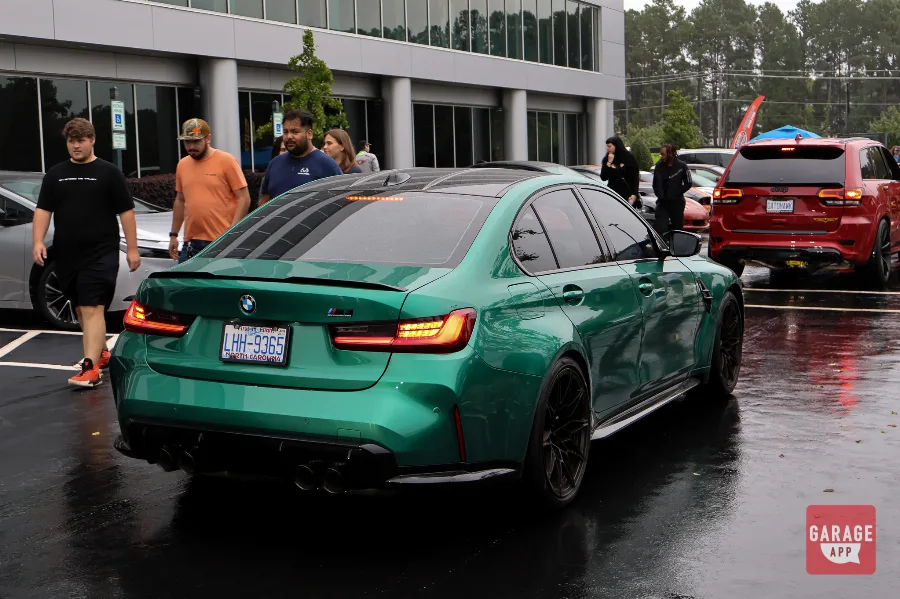 BMW G80 M3 high-performance sports sedan showcased at a BMW enthusiast event with modern M styling and aggressive performance.