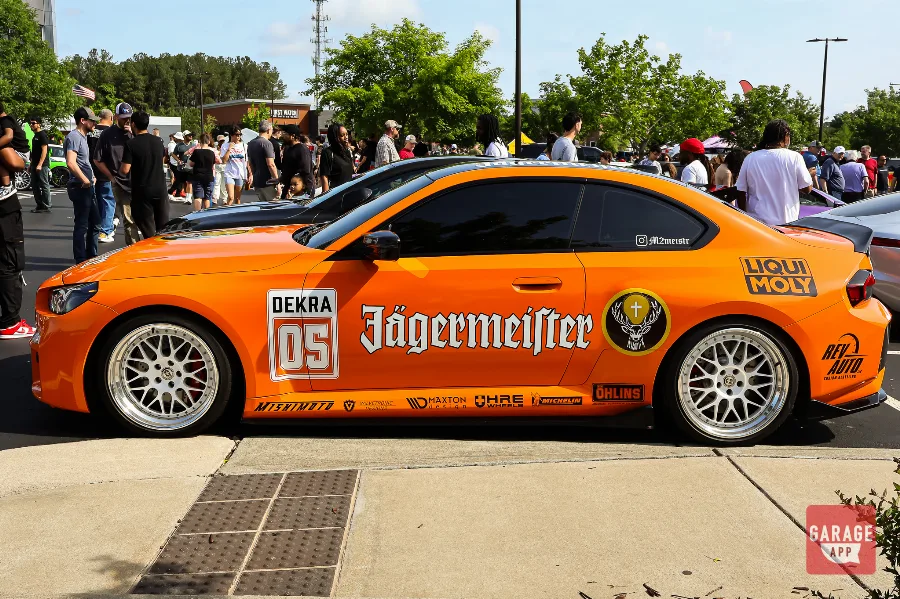 BMW M2 performance coupe displayed at a Cars and Coffee event showcasing BMW M engineering and modern sports car design.