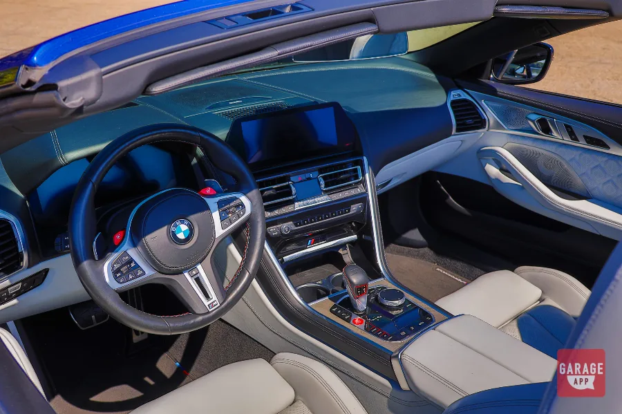 BMW M8 Competition Convertible interior with M steering wheel and gray leather seats