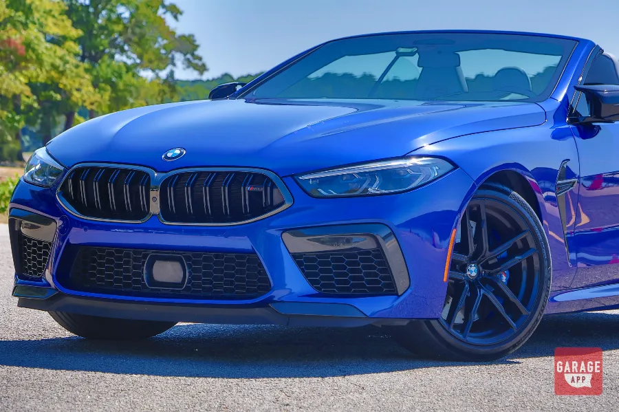 Blue BMW M8 Competition front fascia with black kidney grille and headlights