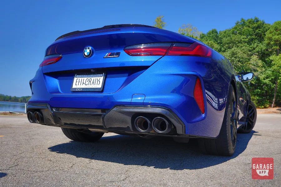 Blue BMW M8 Competition rear, low angle, carbon diffuser and quad exhaust