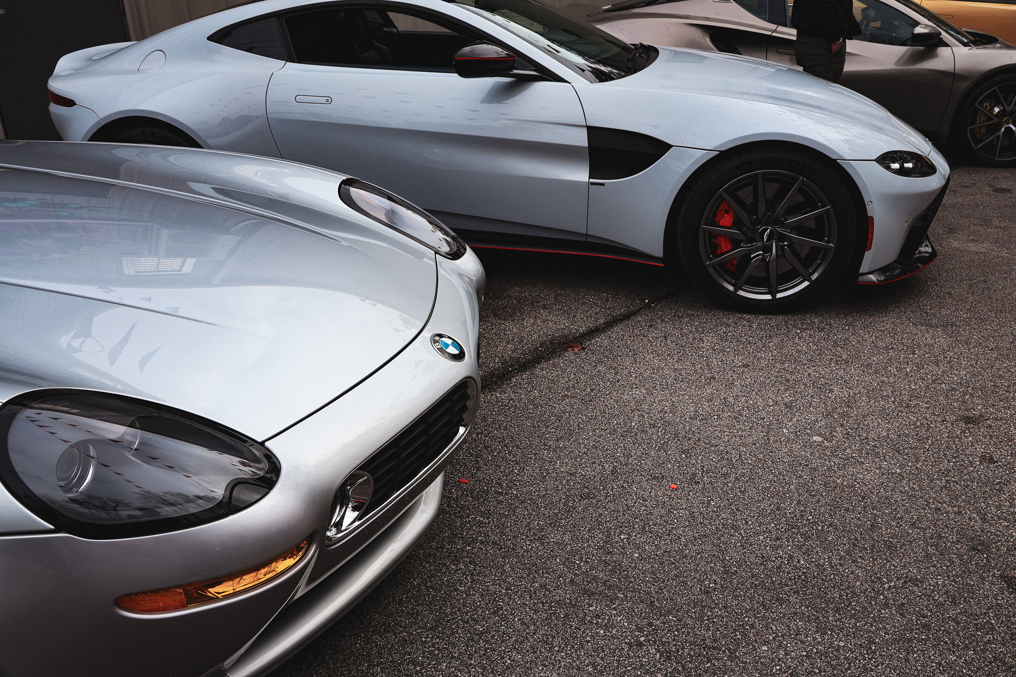 Silver BMW Z8 and Aston Martin Vantage front detail car show