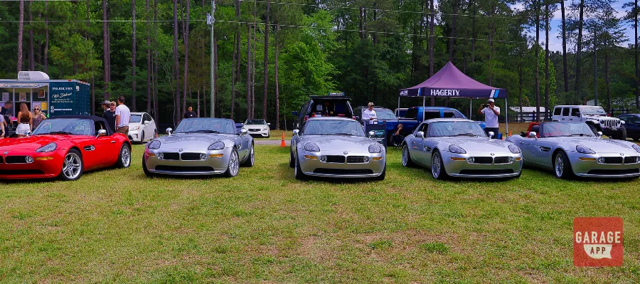 Multiple BMW Z8 roadsters displayed together at a collector car event celebrating one of BMW's rarest modern classics.
