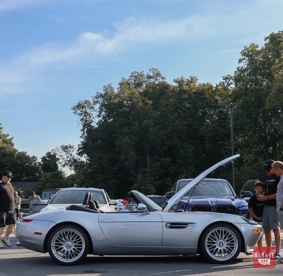 Side profile of a silver BMW Z8 roadster with the hood open at Fuquay-Varina Cars and Coffee.