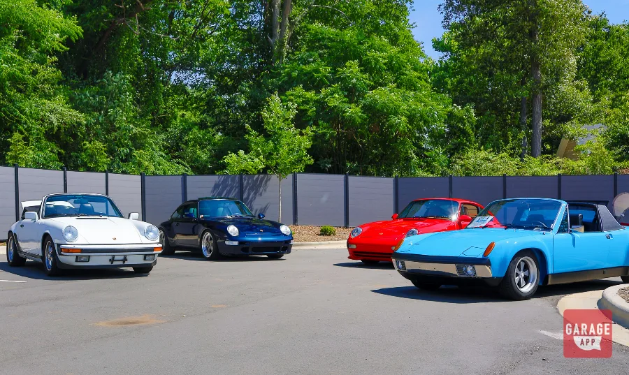 Porsche 911 993 Targa displayed at a classic Porsche gathering, featuring its distinctive glass roof and air-cooled heritage.