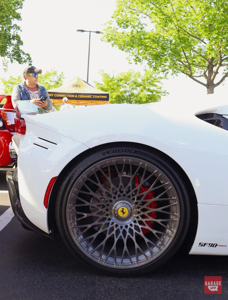 White Ferrari SF90 Spider rear wheel and Brembo brake detail