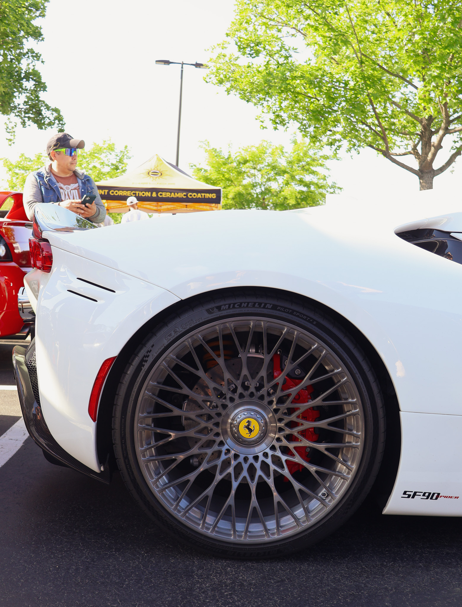 White Ferrari SF90 Spider rear wheel and Brembo brake detail