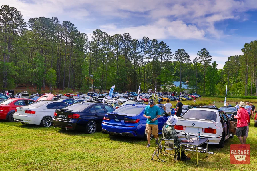 BMW performance and classic vehicles gathered at a Cars and Coffee event showcasing BMW enthusiast culture.