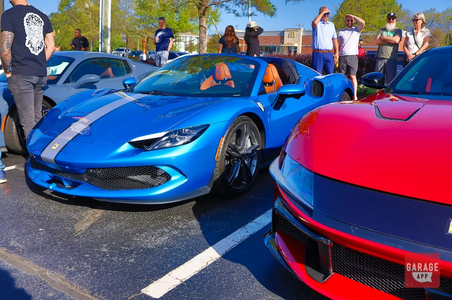 Blue Ferrari 296 GTS front quarter next to red Ferrari