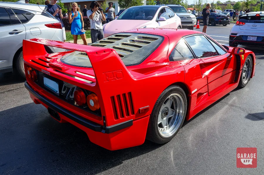Rear three-quarter view of a Ferrari F40 parked during Cars and Coffee Morrisville.