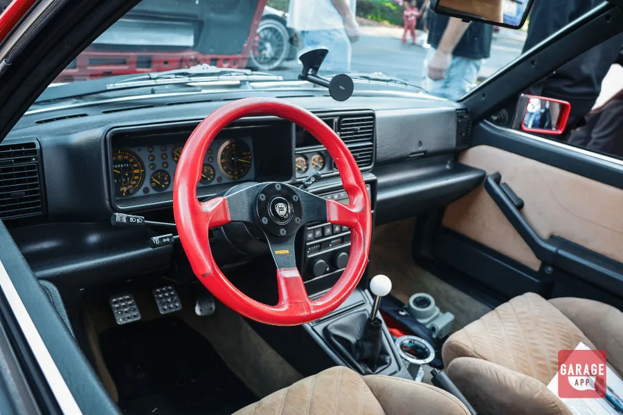 Lancia Delta HF Integrale interior with red Momo wheel and tan seats